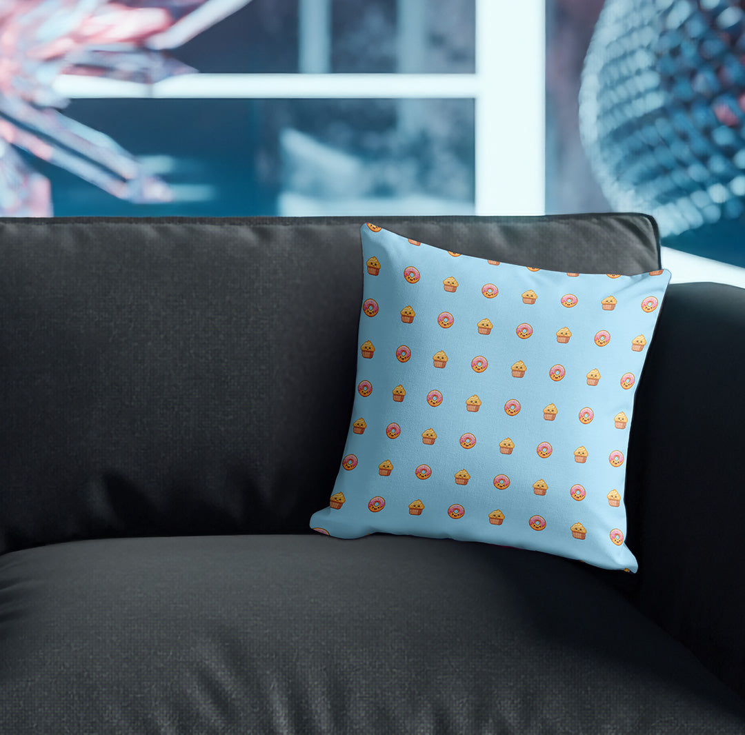 Pillow with cupcakes and donuts pattern on couch