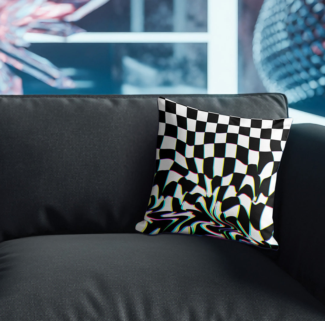 Pillow with abstract checkerboard pattern on couch