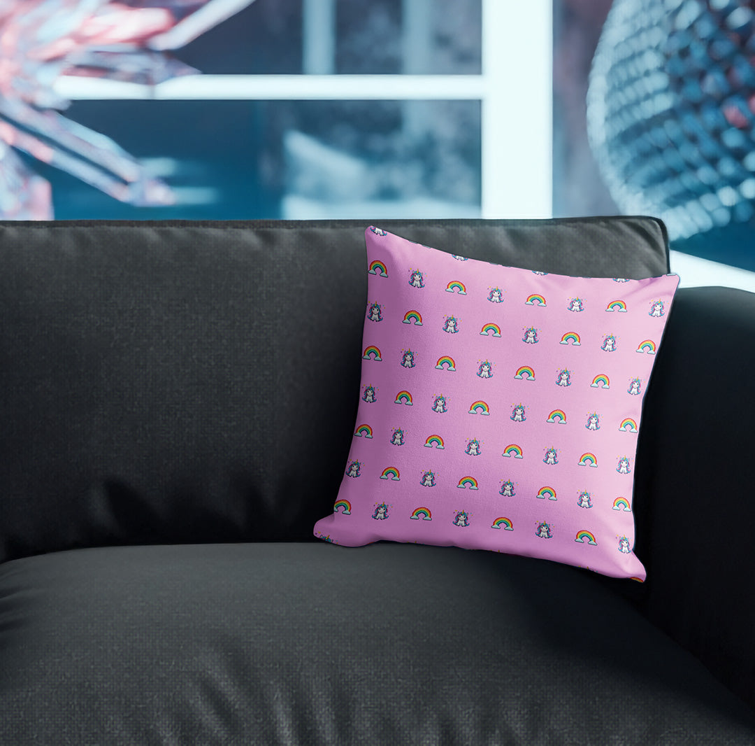 Pillow with unicorns and rainbows pattern on couch
